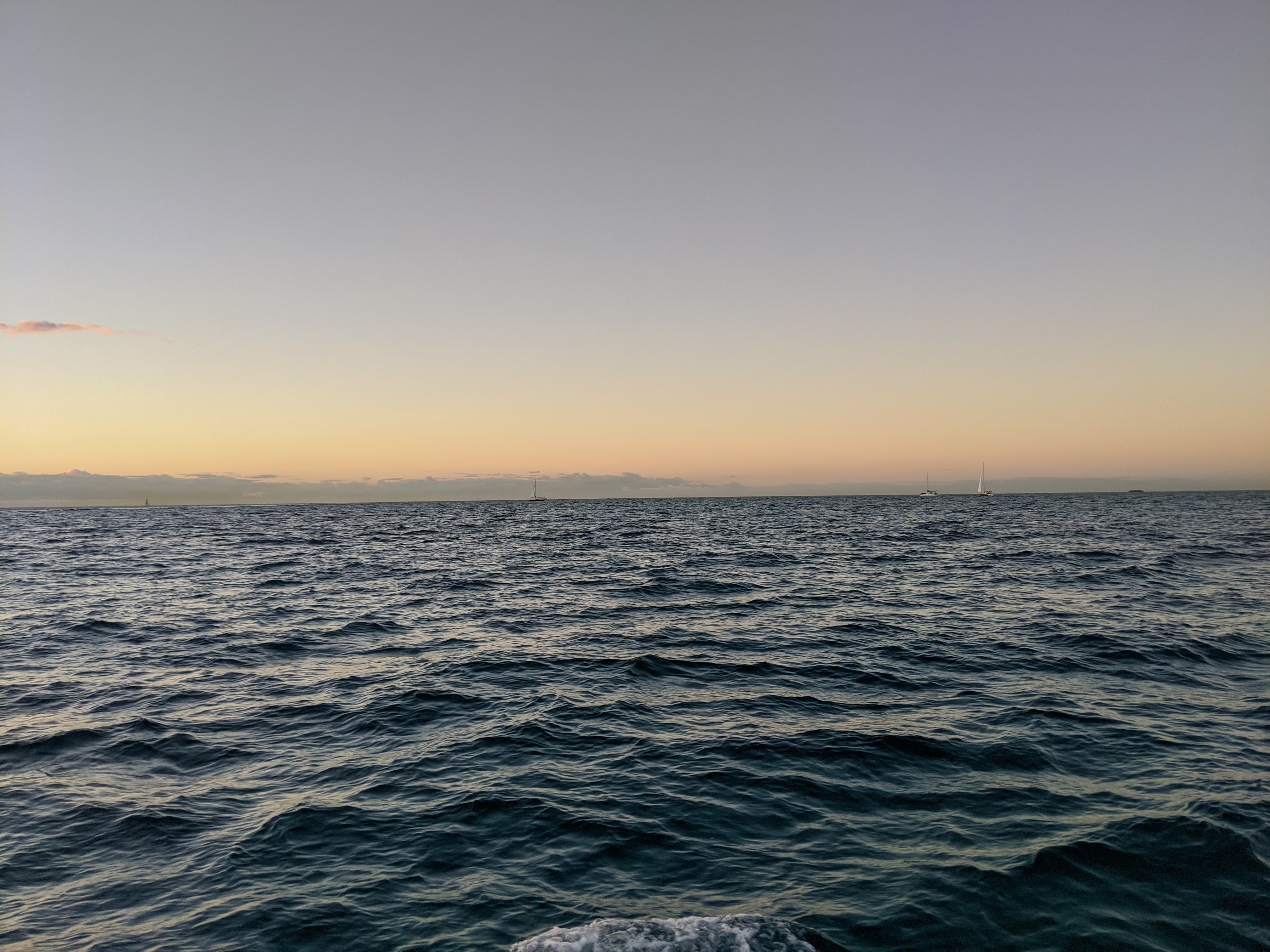 Sailboats on the horizon