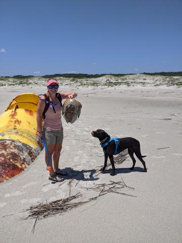 Anna and Louise on the beach with a horseshoe crab